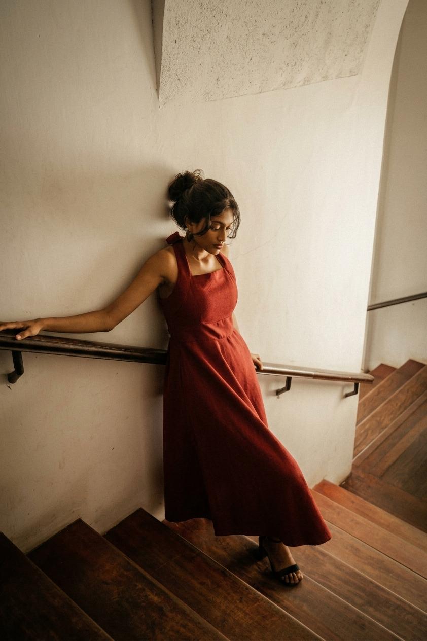 Seetha Dress (Elegant open back dress in burgundy on the Walawwa staircase)